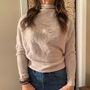 Tan free people sweater with open back and high neck